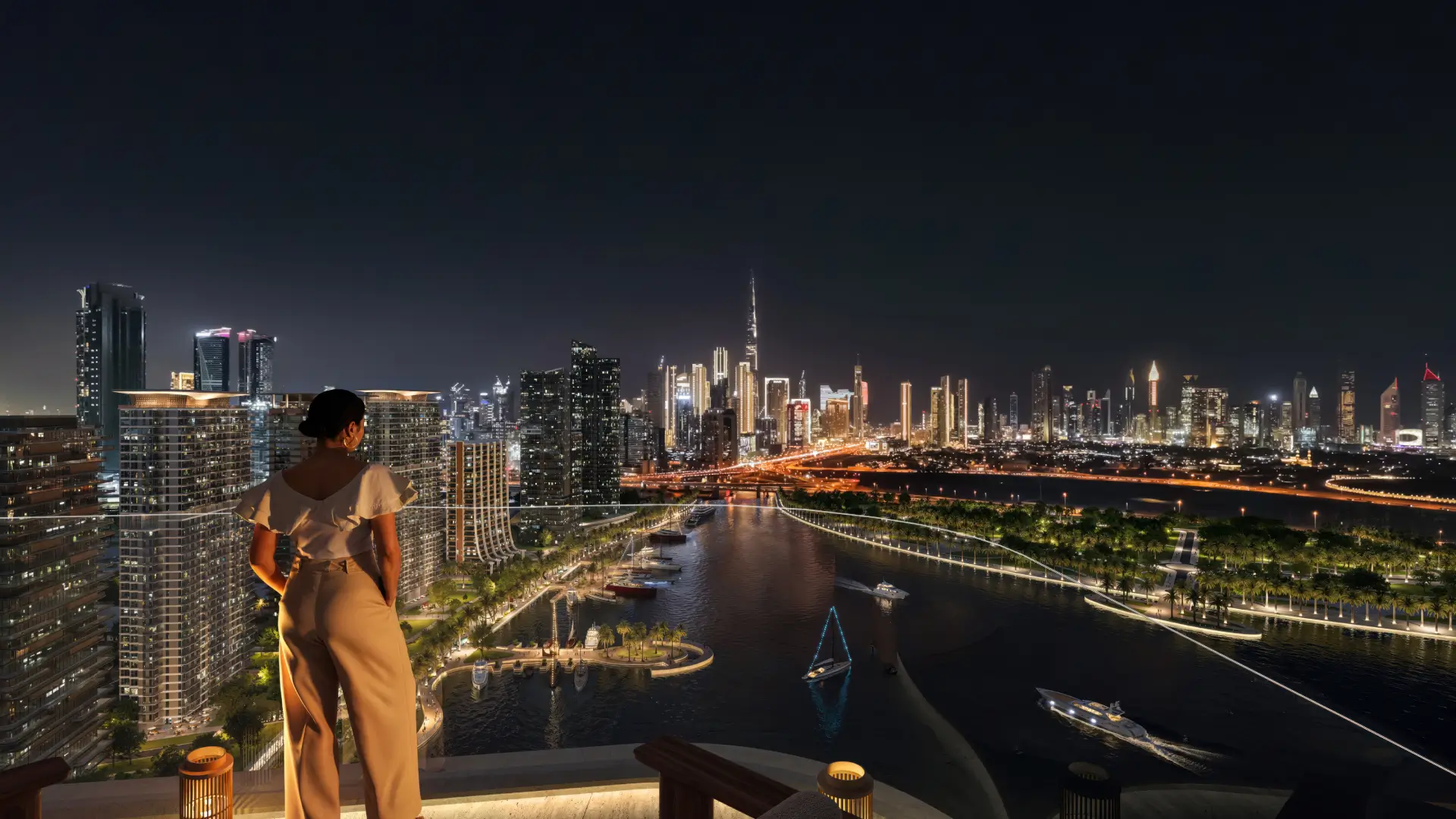 Balcony view from Artistry One Residences overlooking the Dubai Canal and Downtown Dubai skyline at night